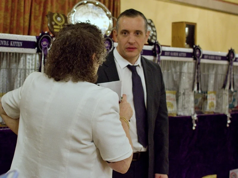 Ross Davies at the GCCF Supreme Cat Show, talking with a fellow judge during Best in Show